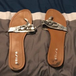 Decorative silver chain thong sandals.